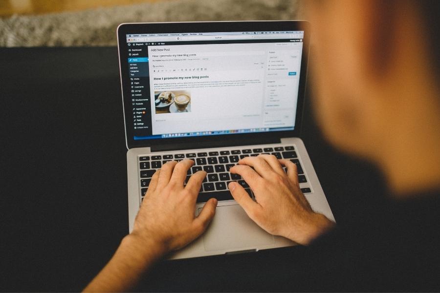 wordpress backup - WP Care man writing an article in WordPress